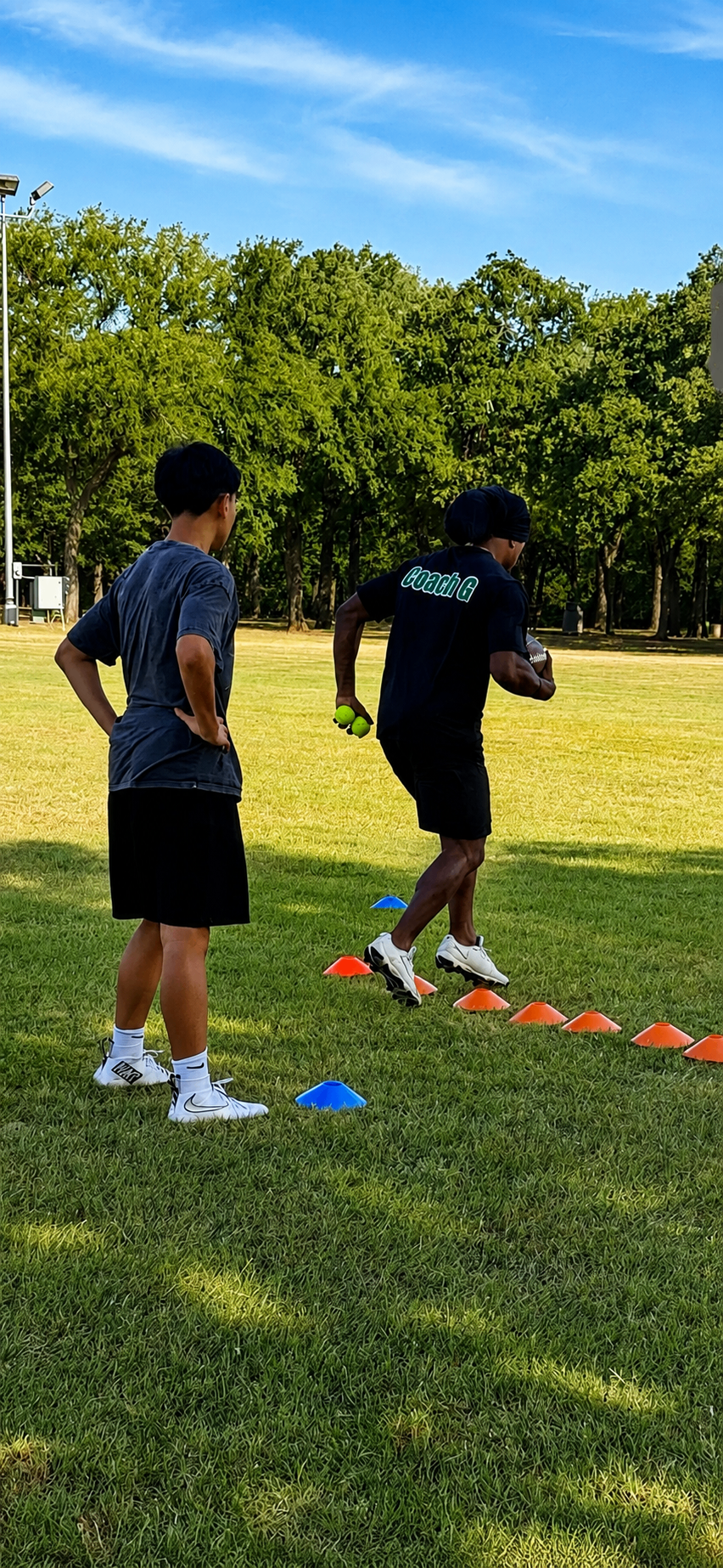 Coach G running cone drills with an athlete